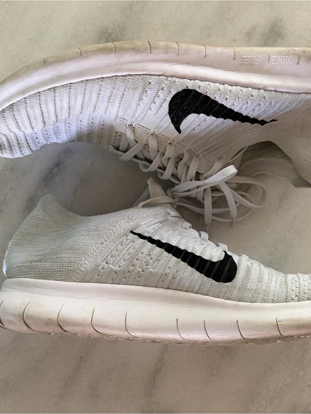 Nike Men’s White Athletic Sneakers with Black Swoosh